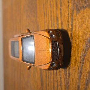 Orange bentley suv